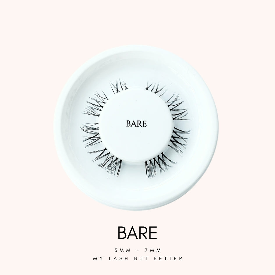 Close up view of HanaDolly's BARE lash style on their iconic white, circular lash tray