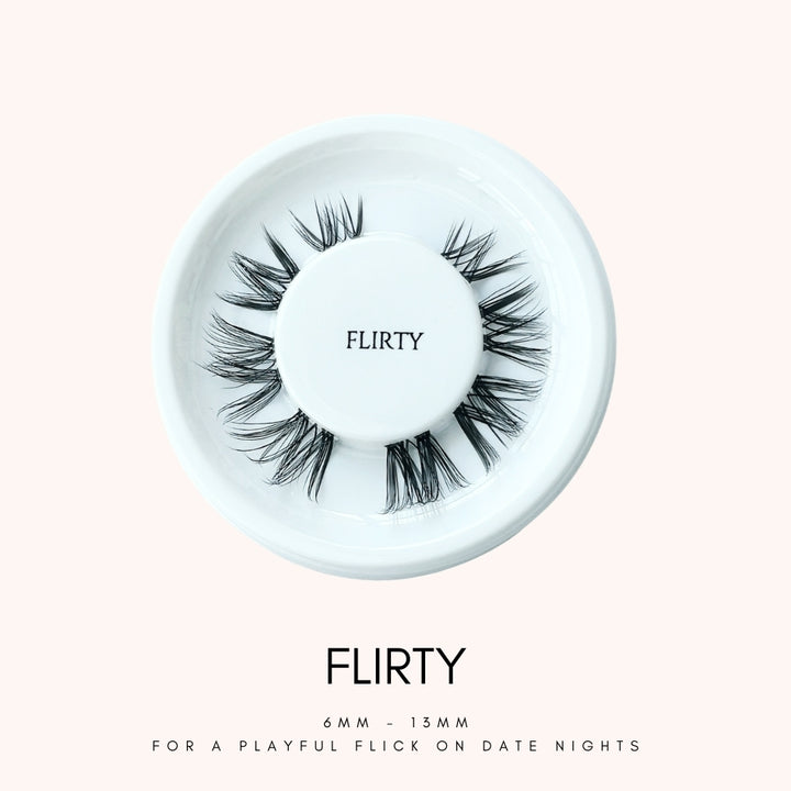 Close up view of HanaDolly's FLIRTY lash style on their iconic white, circular lash tray
