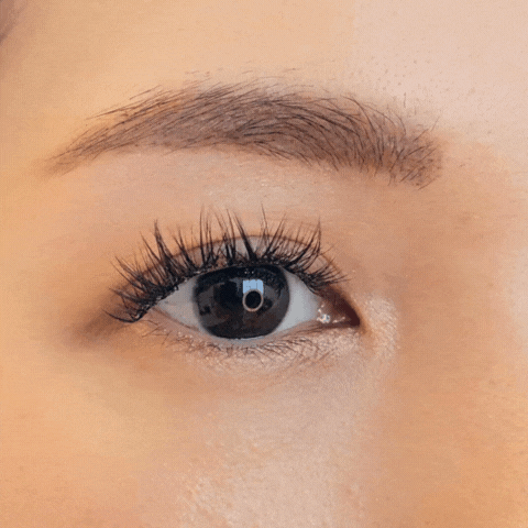 Close up video of a female model's right eye repeatedly blinking and wearing HanaDolly's NATURAL lash style to showcase the DIY lashes in action