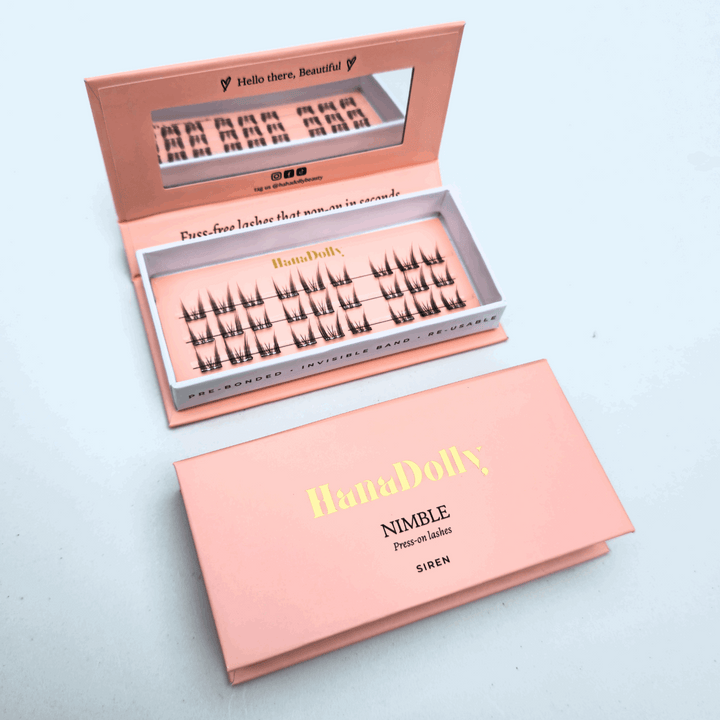 HanaDolly's SIREN self-adhesive lashes displayed with display open box on top and closed box below