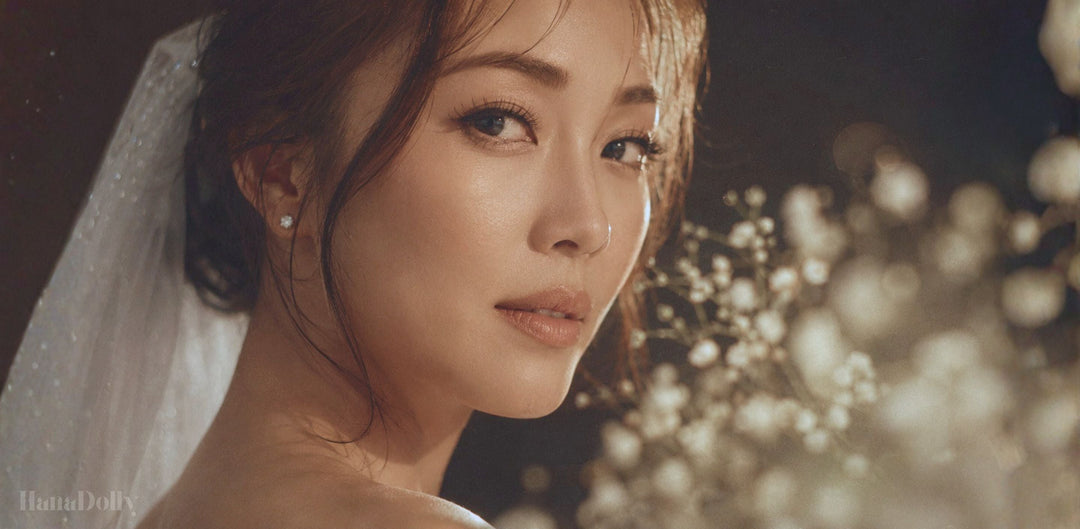 Singapore bride with soft natural makeup, delicate wispy wedding lashes, and a white veil in warm golden light for a romantic bridal lash look.