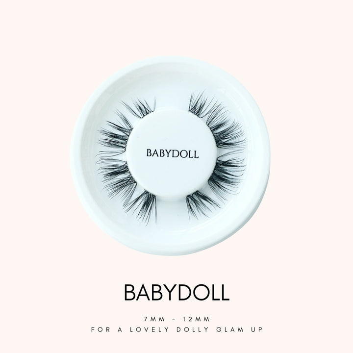 Close up view of HanaDolly's BABYDOLL lash style on their iconic white, circular lash tray