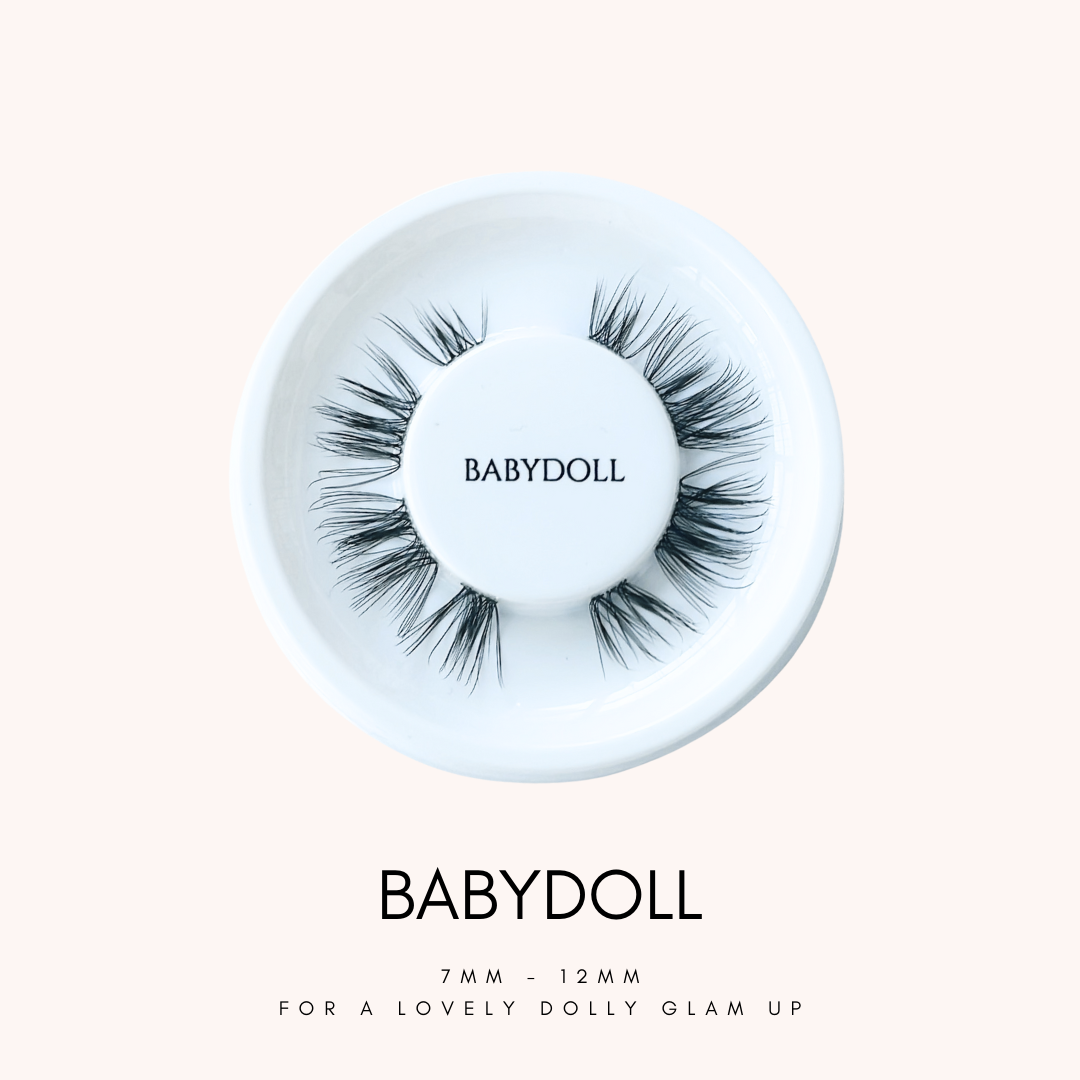 Close up view of HanaDolly's BABYDOLL lash style on their iconic white, circular lash tray