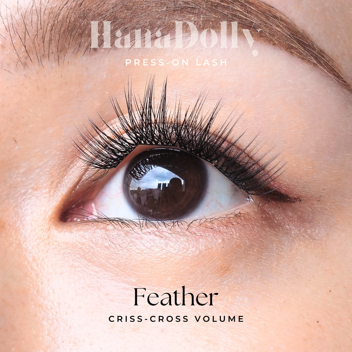 Close up of beautiful model's eye wearing HanaDolly FEATHER press on lashes to showcase the self adhesive lashes in action