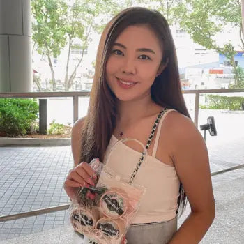 Woman posing with natural-looking HanaDolly lashes