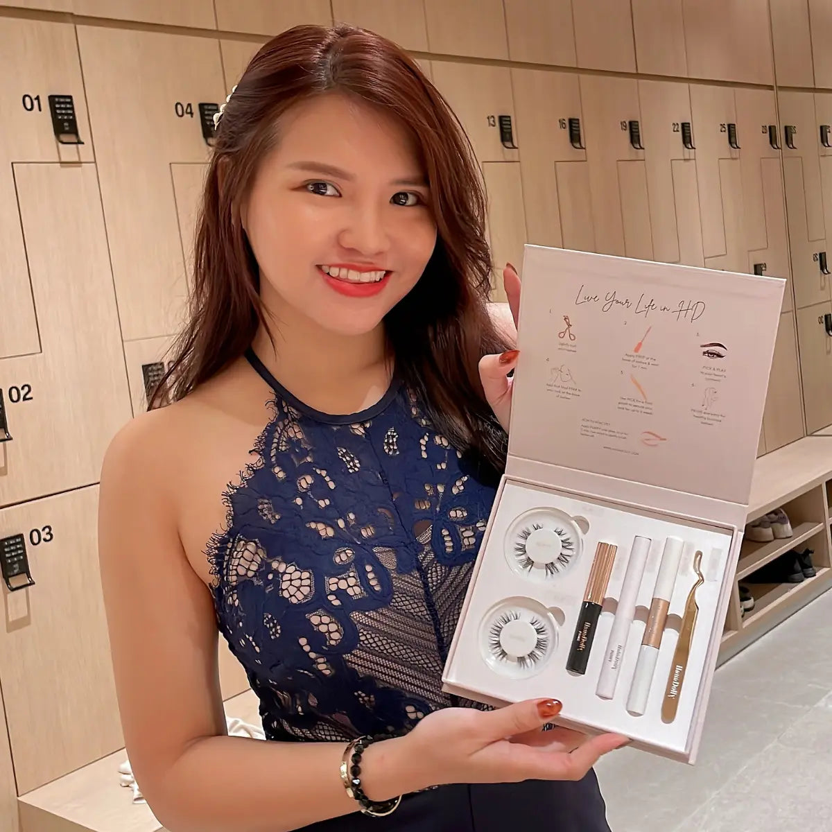 Customer smiling with HanaDolly press-on lash kit for at-home lashes