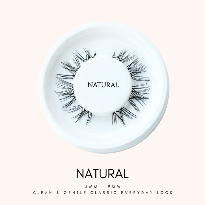 Close up view of HanaDolly's NATURAL lash style on their iconic white, circular lash tray