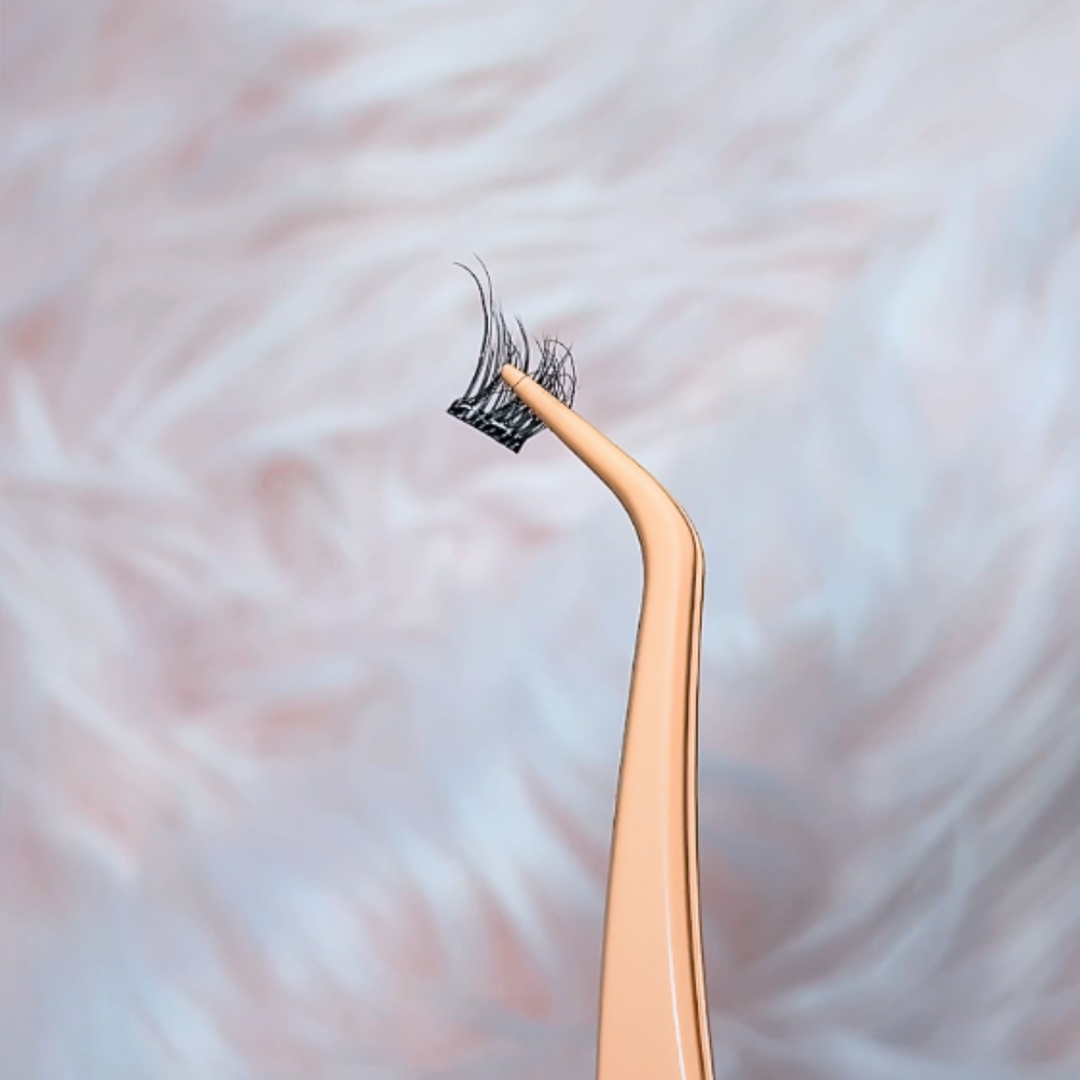 Close-up of HanaDolly PICK lash tweezer holding DIY eyelash cluster for precise application