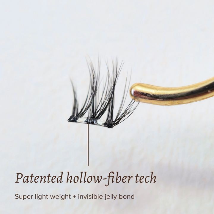 Close-up of self-adhesive press-on lash with patented hollow-fiber technology, lightweight and featuring an invisible jelly bond.