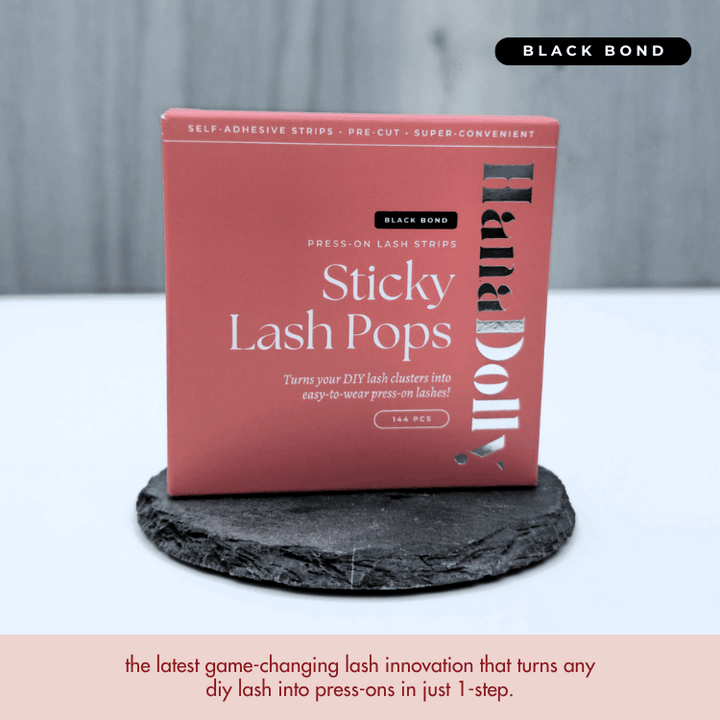 Close up product shot of HanaDolly lash adhesive strips with black bond in red packaging box