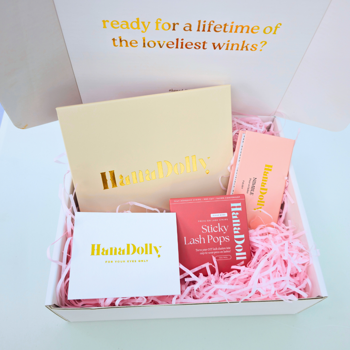 Close up product shot of the Ultimate Lash Mastery Bundle featuring HanaDolly's 7 minute lash routine starter kit, NIMBLE lash, Sticky lash pops in a branded box