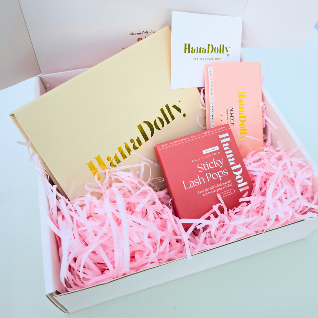 Close up product shot of the Ultimate Lash Mastery Bundle featuring HanaDolly's 7 minute lash routine starter kit, NIMBLE lash, Sticky lash pops in a branded box