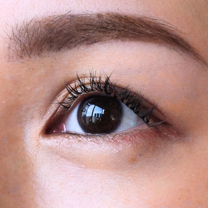 Close up picture of a beautiful female model's right eye wearing HanaDolly's BARE lash style to show the DIY lashes when worn - BARE Lashes MLBB natural look